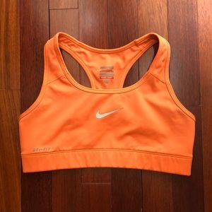 Bright orange Nike sports bra